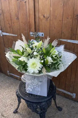 Ivory Kiss bouquet with ivory roses and seasonal blooms